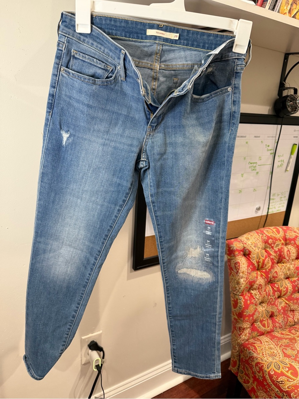 High-Rise Skinny Jeans in Faded Blue — Distressed Detail